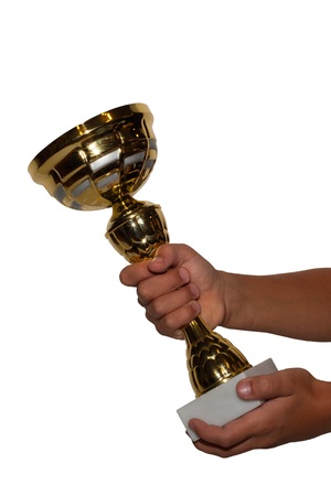 Gold cup in hands. White background. Free space.の写真素材