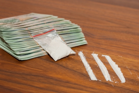 A lot of money and drugs  narcotic, cocaine  on a wooden table  Polish zloty の写真素材
