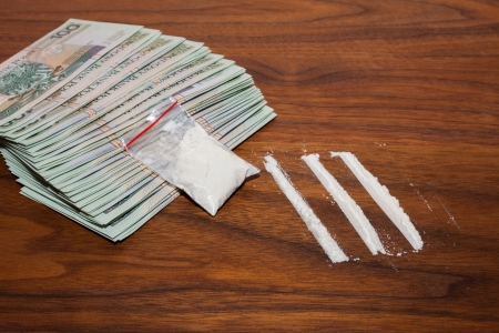 A lot of money and drugs  narcotic, cocaine  on a wooden table  Polish zloty の写真素材