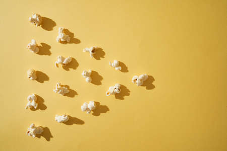 Popcorn on a yellow background. Copy space. Pop corn collection.の写真素材