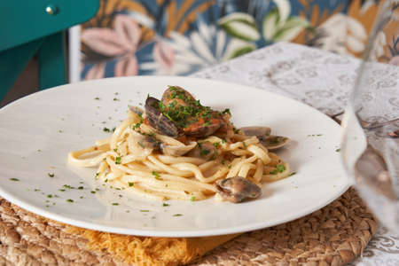 Elegant and Delicious italian pasta dishes served on a white plate in a restaurant. Food conceptの写真素材