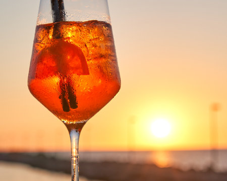 Spritz traditional cocktail with alcohol at a beach bar. European summer drink. Italian drink. Lifestyle conceptの写真素材