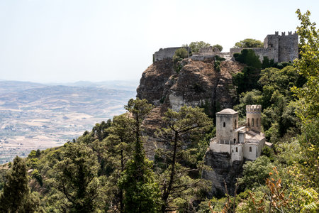 View of Castello Pepoli surrounded by greenery with Castello di Venere above in Erice, Sicilyの写真素材