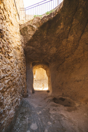 Stone-carved tunnel inside the medieval castle of Sperlinga, Sicilyの写真素材