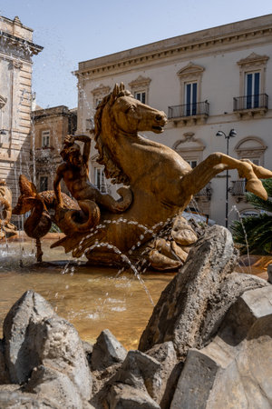 Fountain with horse and merman sculptures in Siracusa, Sicilyの写真素材
