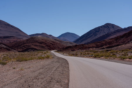 A road through a desert mountain landscape
