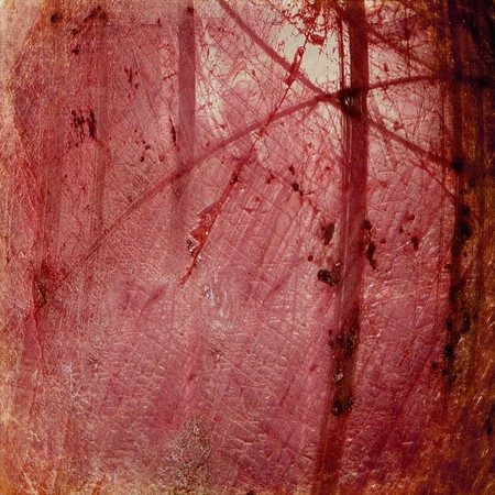 Grunge red luminous cracked abstract textured backgroundの写真素材