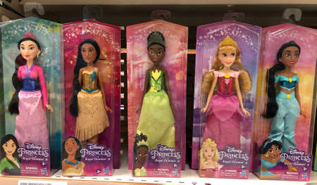 MURCIA, SPAIN - NOVEMBER 2, 2021: Five dolls representing Disney princesses on a shelf in a store of Spain.のeditorial素材