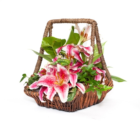 Flower composition with lilies in basketの写真素材