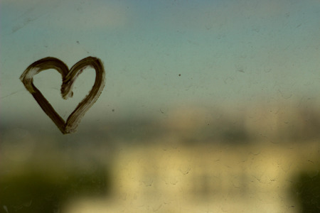 yellow heart on the background of the cityの写真素材