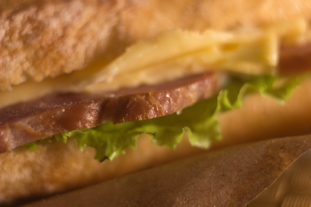 beautiful delicious hearty bacon sandwich with cheese on rye breadの写真素材