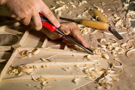 Luthier making top of guitar