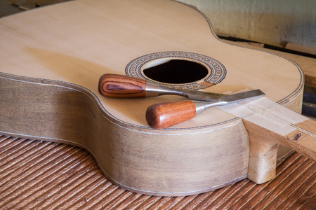 Classical guitar under construction in luthier workshopの写真素材