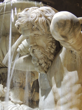 especially in wet marble statue from the water gush from a fountain in the center of Catania, Sicily, Italyの写真素材