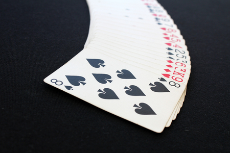 The combination of playing cards poker casino. Isolated on black background poker table
