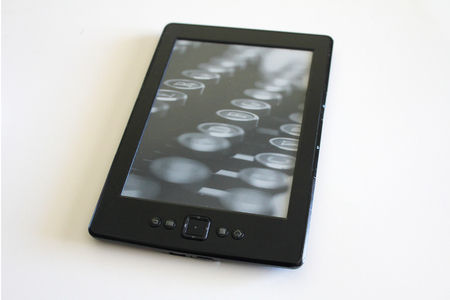Black ebook reader or tablet on white backgroundの写真素材