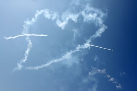 White heart on the blue skyの写真素材