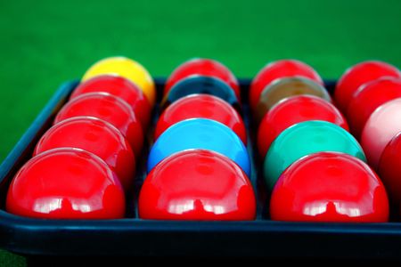 Pool balls prepared to be aligned on table