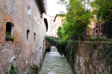 Sasso Marconi 09.12.2010 - Water canal in the back side of italian houseのeditorial素材