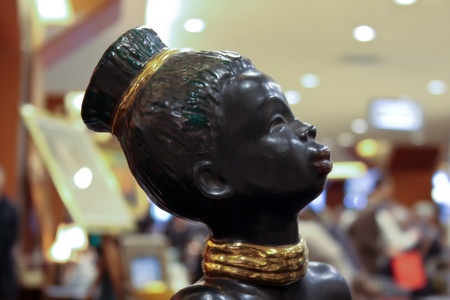 Cluj-NApoca, Romania - April 16, 2011 - Traditional african statuette of young womanのeditorial素材