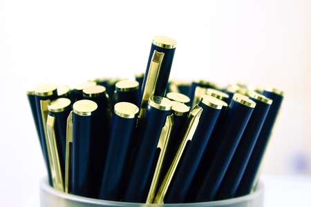 Macro scene with elegant metallic ball pens in containerの写真素材