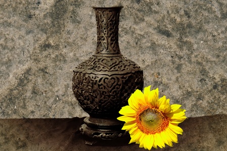 Shot with traditional vase and sun flowerの写真素材