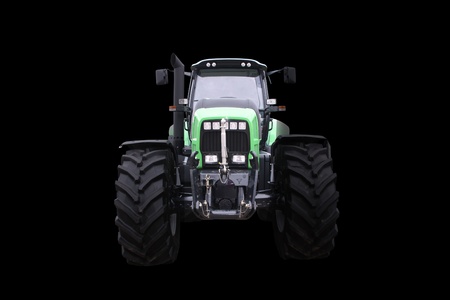 Frontal scene with a new tractor isolated on black background  の写真素材
