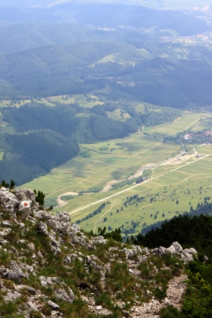 Rural road seen by Piatra Craiului ridgeの写真素材