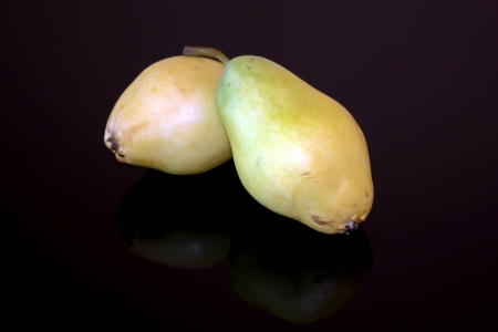Scene with two pears fruits isolated on black background