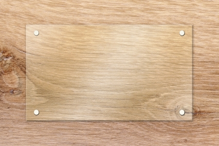 Window glass over wooden plate fixed with setscrews の写真素材