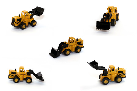 Bulldozer toys over white background