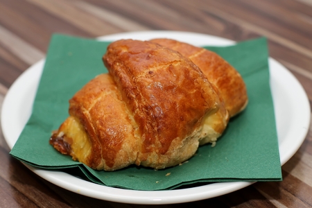 Fresh french croissant on white plateの写真素材