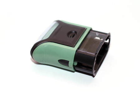 Plastic stamp over white background