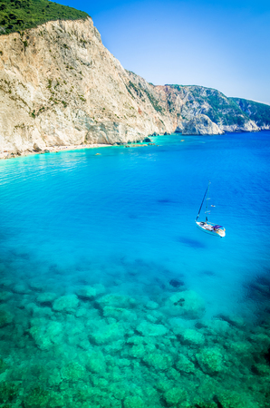 Porto Katsiki beach in Lefkada island, Greece. Beautiful view over the beach. The water is turquoise and there are a boat on the sea.の写真素材