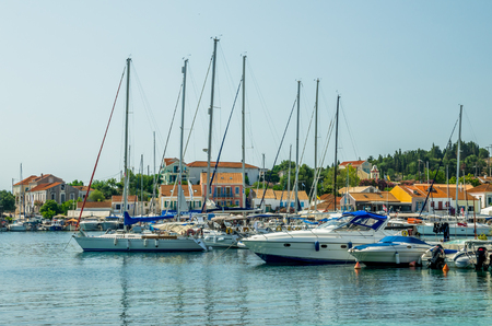 FISKARDO TOWN, KEFALONIA ISLAND, GREECE - JULY 12, 2015: Bay of Fiskardo with boats and yachts.のeditorial素材