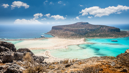Balos lagoon on Crete island, Greece. Tourists relax and bath in crystal clear water of Balos beach.の写真素材