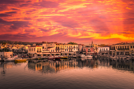 RETHYMNO, CRETE ISLAND, GREECE JUNE 29, 2016: Stunning sunset over the old venetian port of Rethimno on Crete island Greece.のeditorial素材