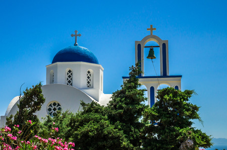 Greek Church on Santorini island, Greece. Small white and blue church in Cycladesの写真素材