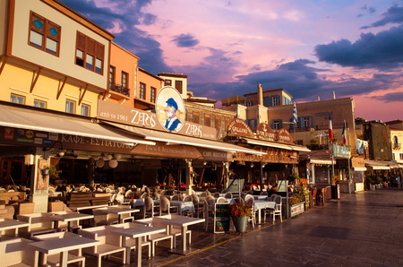 CHANIA, CRETE ISLAND, GREECE - JUNE 26, 2016: Stunning sunset view of the old venetian port of Chania on Crete island, Greece.のeditorial素材