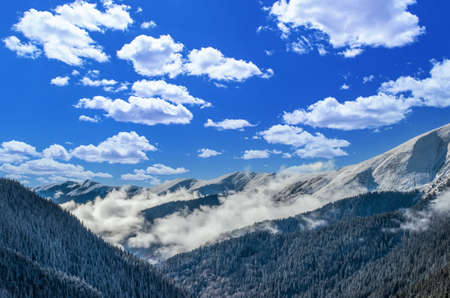Stunning view of Fagaras mountains in winter. The ridge of the mountain full of snow. There are one of the beautiful road in the world, Transfagarasanの写真素材