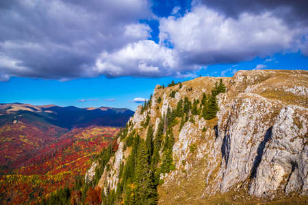 Autumn in Buila Vanturarita National Park, Carpathian Mountains, Romania. Vivid fall colors in forest. Colorful Autumn Leaves. Green, yellow, orange, red.の写真素材