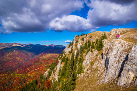 Autumn in Buila Vanturarita National Park, Carpathian Mountains, Romania. Vivid fall colors in forest. Colorful Autumn Leaves. Green, yellow, orange, red.の写真素材