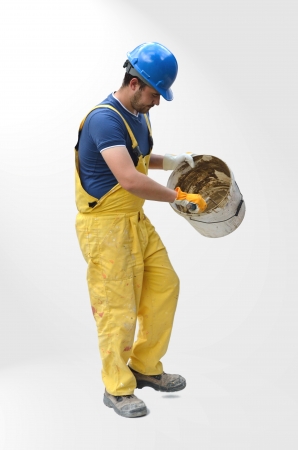 Construction worker with bucketの写真素材