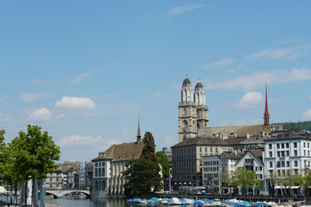 Skyline of historical buildings in Zurich, with two towers of Grossmünster, on the background and river Limmatのeditorial素材