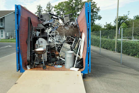 Metal waste collected in a container in a community disposal place. A public service free of charge...