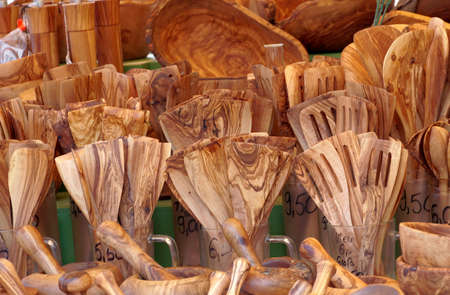 Close up view on wooden dinner sets consist from forks, spoons,  dishes, bowls, dippers and ladles...