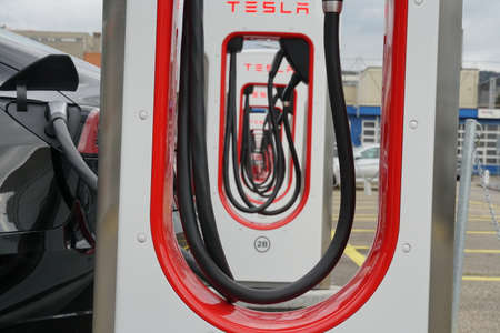 Dietikon / Switzerland 10 10 2020: Front view of Tesla electric charging stations arranged in a row in perspective. They are located in an industrial zone on the outskirts of Zurich.のeditorial素材
