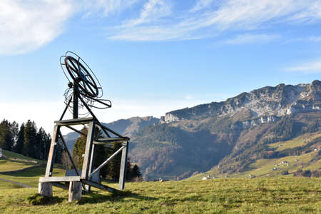 A small ski lift out of service in late autumn on the top of a slope in Amden, a tourist and ski...