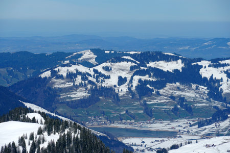 Landscape in Canton Schwyz Switzerland and a part of Sihl lake as observed from the ski resort Hoch Ybrig in winter. Aerial or high angle view.の写真素材