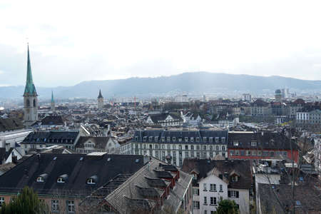 Zurich, Switzerland - 03 12 2020: Panorama of Zurich historical center. Green church tower of Predigerkirche, is on the left hand side. Panoramic view in the old city.のeditorial素材